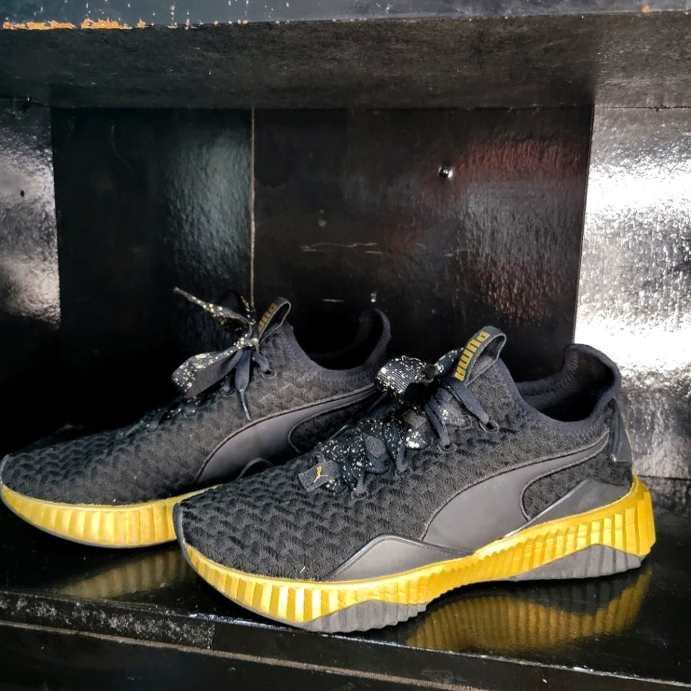 Puma Black and Gold shoes